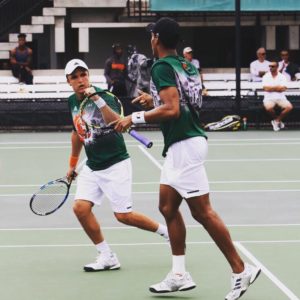 Pablo Aycart fist pumping in College Tennis Match